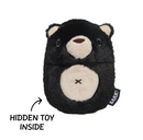 A black plush bear-shaped item with cream-colored snout, ears, and belly patch, shown on a white background with an arrow and text reading 'HIDDEN TOY INSIDE' and a small side tag that reads 'BARK'.